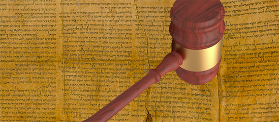 Picture of an old manuscript with a gavel.